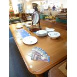 A very large 19th century walnut dining table with three extra leaves, chamfered top above four