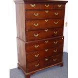 An 18th Century mahogany chest on chest, the outset cornice above an arrangement of three small