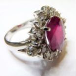 An 18 carat white gold large ruby and diamond cluster ring