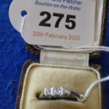 An 18-carat yellow-gold and platinum set three-stone diamond dress ring in an Art Deco design (