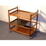 A 1960's/70's Danish three tier rosewood tea trolley having two bowed handles to the top and