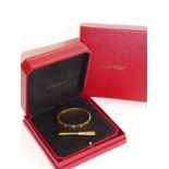 Aldo Cipullo, for Cartier circa 1970, an 18K yellow-gold love bracelet, boxed and with original