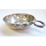 A thick gauge hallmarked silver circular wine taster, assayed London 1933 (approx. 104g)