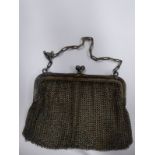 An early 20th century lady's silver mesh purse, maker's mark C & C and stamped 925, with chain