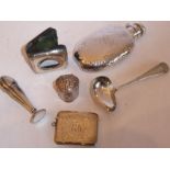 A bijouterie group of six to include a hand-planished silver flask, a small Dutch spice box, a