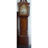 An early 19th century oak and mahogany cased eight-day longcase clock; the 13.15" broken-arch dial