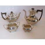 A four-piece hallmarked silver tea and coffee service in the Georgian style and comprising coffee