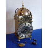 A good 19th century brass lantern clock in the 17th century style; silvered chapter ring with