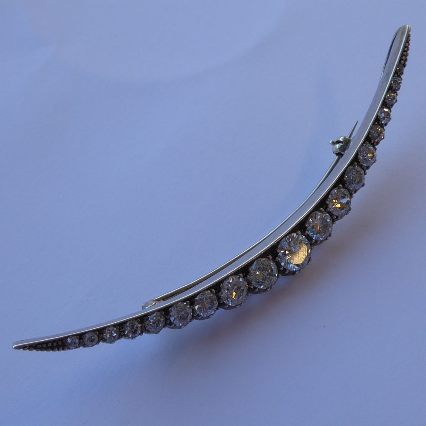 A very fine early 20th century platinum and 18-carat gold claw-set 19-stone diamond brooch of - Image 11 of 16