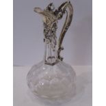 A 19th century cut glass globe-and-shaft shaped silver-mounted claret jug; the mounts in earlier