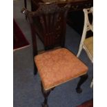 A late George II period mid 18th Century mahogany salon chair, the tightly foliate carved top fail