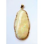A rare and large Australian opal pendant, approx 60 carat in 18-carat gold mount, in velvet pouch (