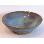 A Chinese Yuan/Ming Junware circular dish; sky-blue glaze raised on unglazed circular foot (12.5cm