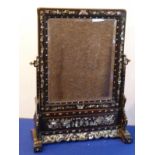 An ornate late 19th century Chinese hardwood toilet mirror; profusely inlaid with mother-of-pearl