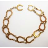 A 9 carat gold 'Horseshoe' braceletWeight is approximately 9.43gm. The Auctioneer states that the