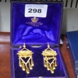 A pair of 19th century yellow-metal Egyptian revival style earrings; original box marked for J.