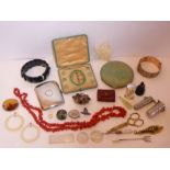 An assortment of interesting items to include jewellery, silverware, a green enamel and silver