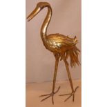 An early to mid-20th century decorative gilt-metal stork (47.5cm high) The stork is quite heavy