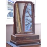 A mid-18th century walnut and parcel-gilt-framed toilet mirror; three ogee-shaped drawers and raised