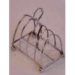 A 19th century hallmarked silver four-division toast rack; the divisions modelled as Gothic