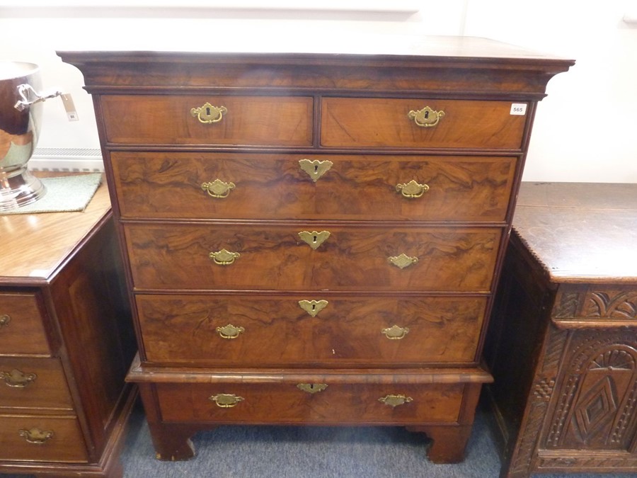 An early 18th century walnut chest-on-stand, two half-width over three full-width graduated