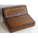 A mid 19th Century brass, copper and mother of pearl inlaid writing slope, the slanting fall with