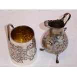 A 19th century tapering cylindrical tankard decorated with scrolling foliage, together with a