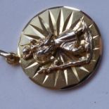 A gilt-metal/gold (one impressed mark verso) St. Christopher pendant (2.5cm diameter)