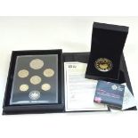 A cased proof coin set together with a £5 proof coin