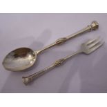 Omar Ramsden, a heavy hallmarked silver spoon with a central wrythern stem, assayed London 1919;