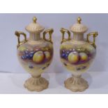 A pair of early 20th century Crown Devon Fielding's two-handled, baluster-shaped vases and covers;