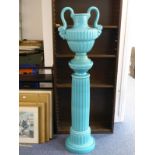 A late 19th/early 20th century blue-glazed two-handled urn on conforming pedestal; the urn with