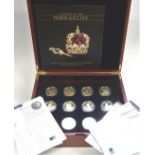 A cased set of twelve gold-plated silver £5 proof coins, 'History of the Monarchy'