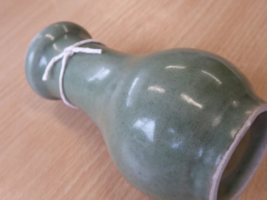 A Chinese Southern Song period small celadon glaze bottle vase; the lip above a slightly tapering - Image 8 of 16