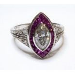 An 18 carat ruby and .75 carat marquis diamond ring