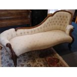 A mid 19th Century carved walnut and button back upholstered chaise longue on moulded cabriole front