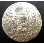 A 1742 large silver piece of eight reputed to have been recovered from the shipwreck of the 'The
