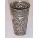 A 19th century tapering cylindrical Chinese silver beaker; vacant shield-shaped cartouche and a