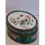 An early 20th century oval Chinese canton enamel box; the cover decorated with butterflies and