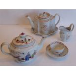 A circa 1800 New Hall oval ogee section teapot and cover decorated in iron red with flowers and