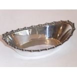 A small hallmarked silver boat-shaped bowl with gadrooned border, maker's mark Hamilton & Inches,
