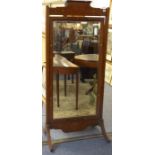A Regency style mahogany and floral marquetry Cheval mirror on standard style end with downswept