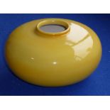 An unusual circa 1922-1927 Royal Doulton yellow-glaze pottery vase of squat spherical form;