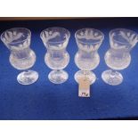 A set of six thistle-shaped wine goblets; finely engraved with thistles to the underside of the