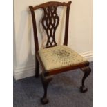 An 18th century-style mahogany child's chair after Thomas Chippendale, carved top rail above pierced