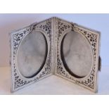 A heavy hallmarked silver double photograph frame; marked for the Goldsmiths & Silversmiths Company,