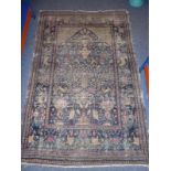 A hand-knotted Persian prayer rug; probably late 19th/early 20th century, the central rectangle with