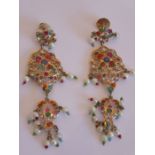 An elaborate pair of Indian yellow-metal drop earrings set with a profusion of hand-cut stones and