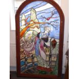 A highly unusual late 19th century/early 20th century stained-glass panel arched door depicting a