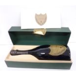 A bottle of Dom Pérignon 1990 vintage champagne in its original presentation case